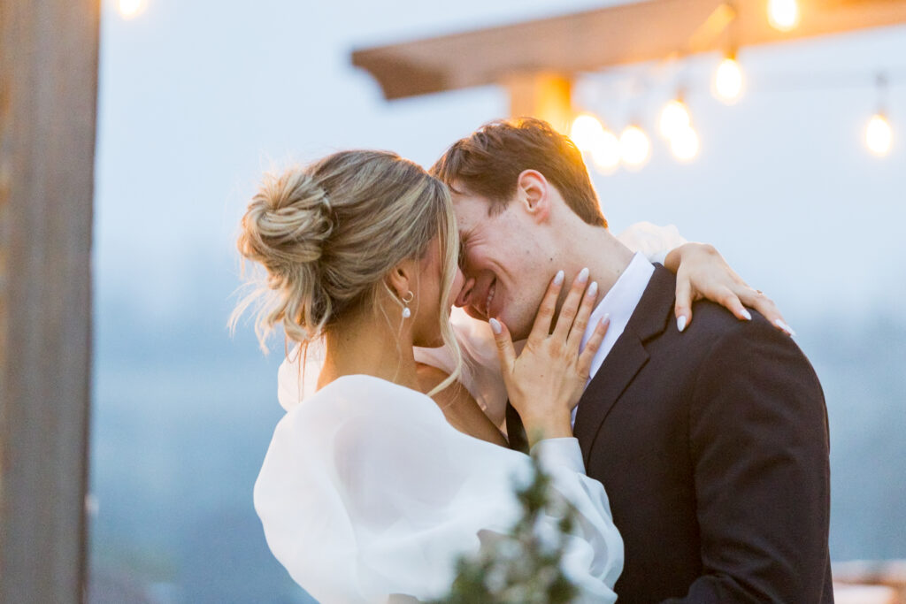 bride and groom happy kiss